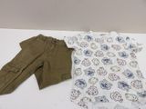 a white shirt and brown pants sitting on a table