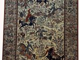 an antique persian rug with horses and horses on it
