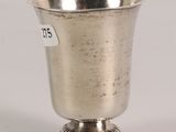 silver plated cup on pedestal with a price tag on the side