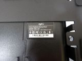 a close up of a black laptop with a label on it