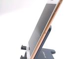 a cell phone that is sitting on a stand