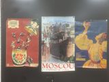 posters on the wall of a building that says moscow