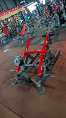 a gym with a lot of exercise equipment in it