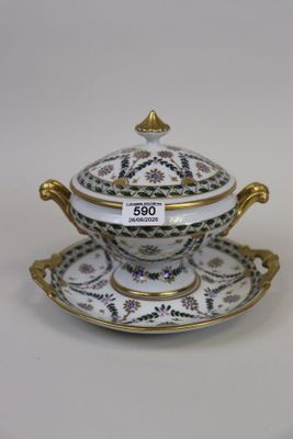 a close up of a bowl and saucer on a plate