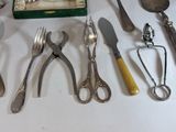many different types of silverware on the table