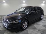 an image of a black audi wagon parked in a garage