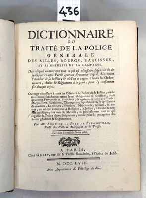 an open book on a table with a tag attached to it