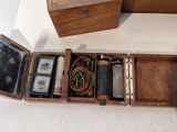 a small wooden box with a lot of things inside of it