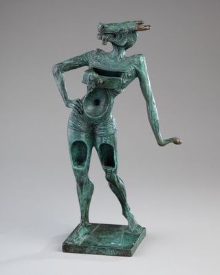 an image of a bronze statue of a woman with a hat on her head