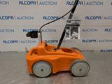 a close up of a toy car on a table in front of a wall