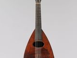 a close up of a mandolin on a white background
