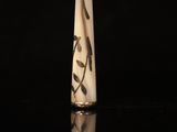 a close up of a white vase with black writing on it