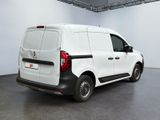 the rear of a white van is parked in a room