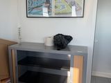 a picture of a living room with boxes on the floor