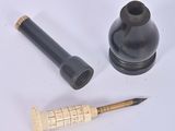 a pen, inkwell, and ink bottle sitting on a table