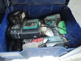 a blue box with tools inside of it on the floor