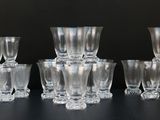 a lot of glasses that are sitting on a table
