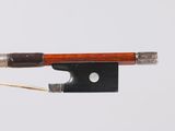 a bow that is attached to a string on a white background