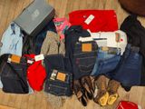 a lot of clothes and shoes on the floor