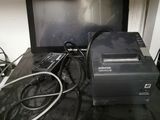 a laptop computer sitting on top of a desk with a printer on top of it