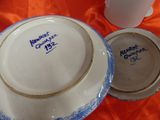 a bowl and a plate sitting on a table