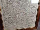 a picture of a map hanging on a wall