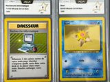 two pokemon cards with a picture of a computer and a laptop