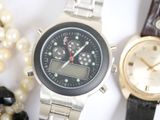 two watches sitting next to each other on a table