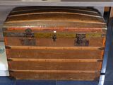 an old trunk sitting on a table in a room