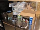 a kitchen counter with a lot of items on it