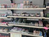 many shelves of cosmetics and makeup products in this store