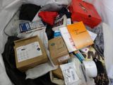 a bag full of items that are sitting on the floor