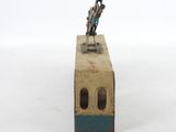 a toy of a man riding a bike on top of a box