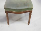a small stool with a green seat on a white background