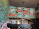 many menus on the wall in this restaurant