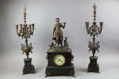 three different types of clocks on display on a white background