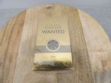 a box of cigarettes sitting on a wooden table