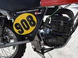 a close up of a motorcycle with a number plate on it