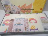 a baby playmat in the box on the table