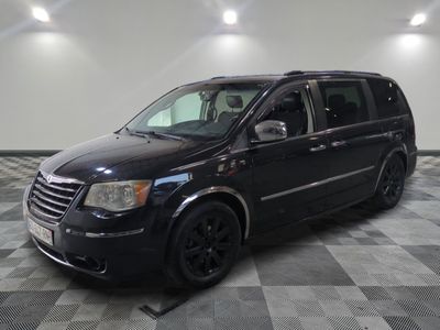 a picture of a black van parked in a garage