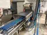 a conveyor belt with a conveyor belt attached to it