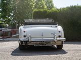 a white car that is parked in a parking lot