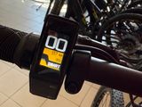 a bike with a cell phone attached to it ' s handlebar