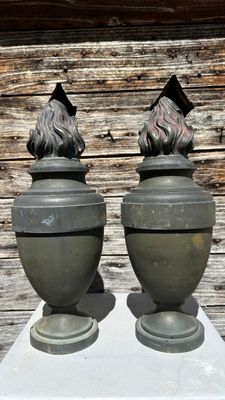 two vases that are sitting on top of a table