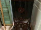a black cabinet with a mirror on it in a room