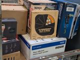 many boxes of electronics on a shelf in a store