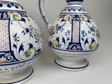 two vases that have been decorated with blue and white designs