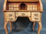 a wooden desk with drawers and drawers on top of it