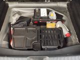 a trunk of a car with a bunch of items in it