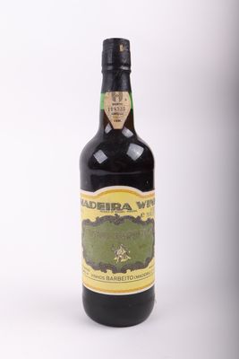 an image of a bottle of wine sitting on top of a table